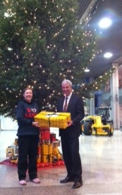 David Bell presents Zoe with the JCB gift to Malawi